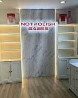 Custom dynamic RGB backlit sign environment at Not Polish studio in El Cajon, CA