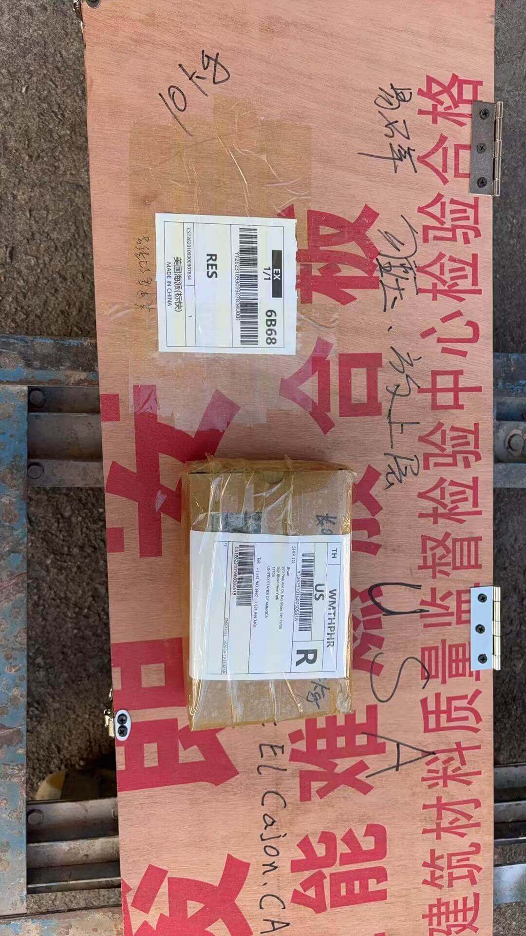 Sealed heavy-duty plywood export crate with international shipping label