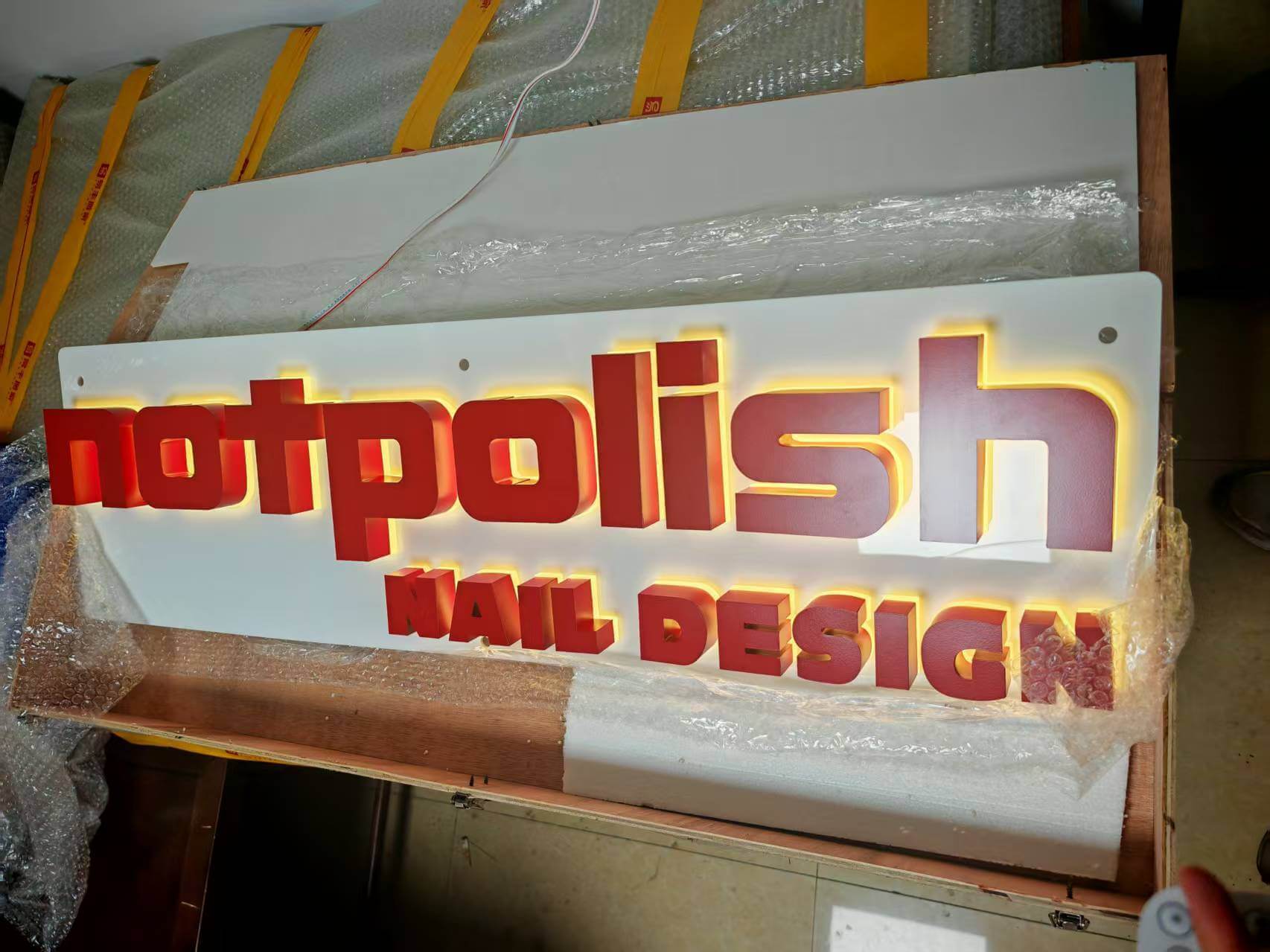 Warm amber halo lighting test on dynamic RGB backlit sign