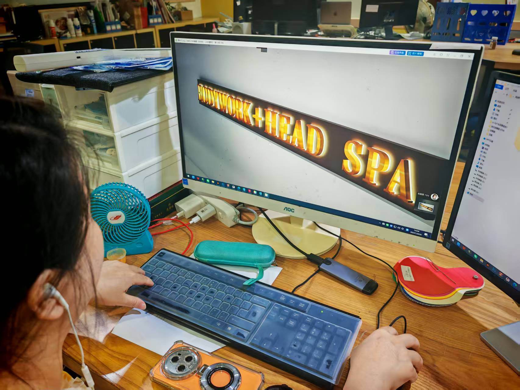 Sign engineer redesigning CAD vector layout on workstation