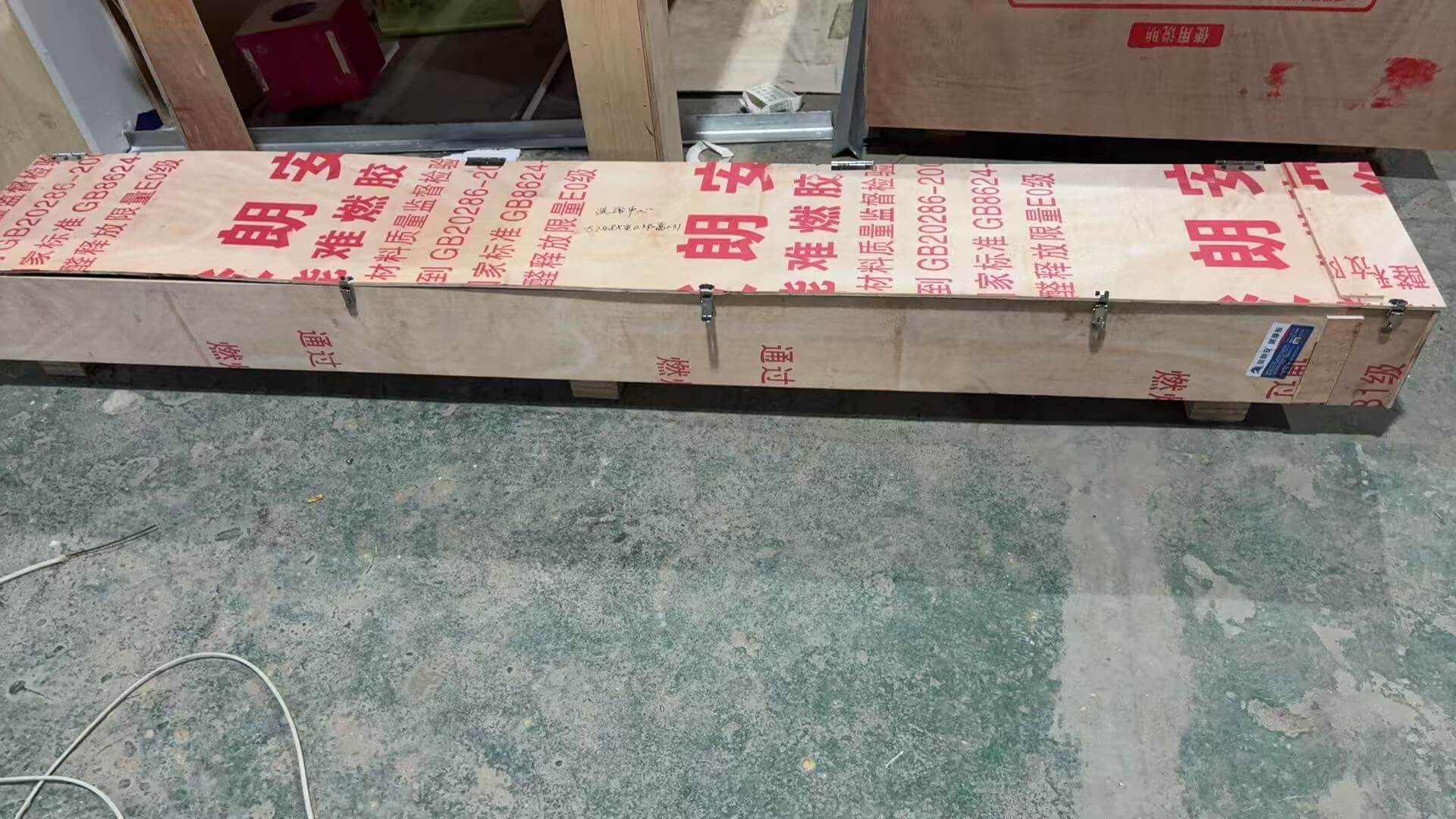 Custom illuminated sign air cargo crating at EndPoint Sign's Guangzhou engineering center