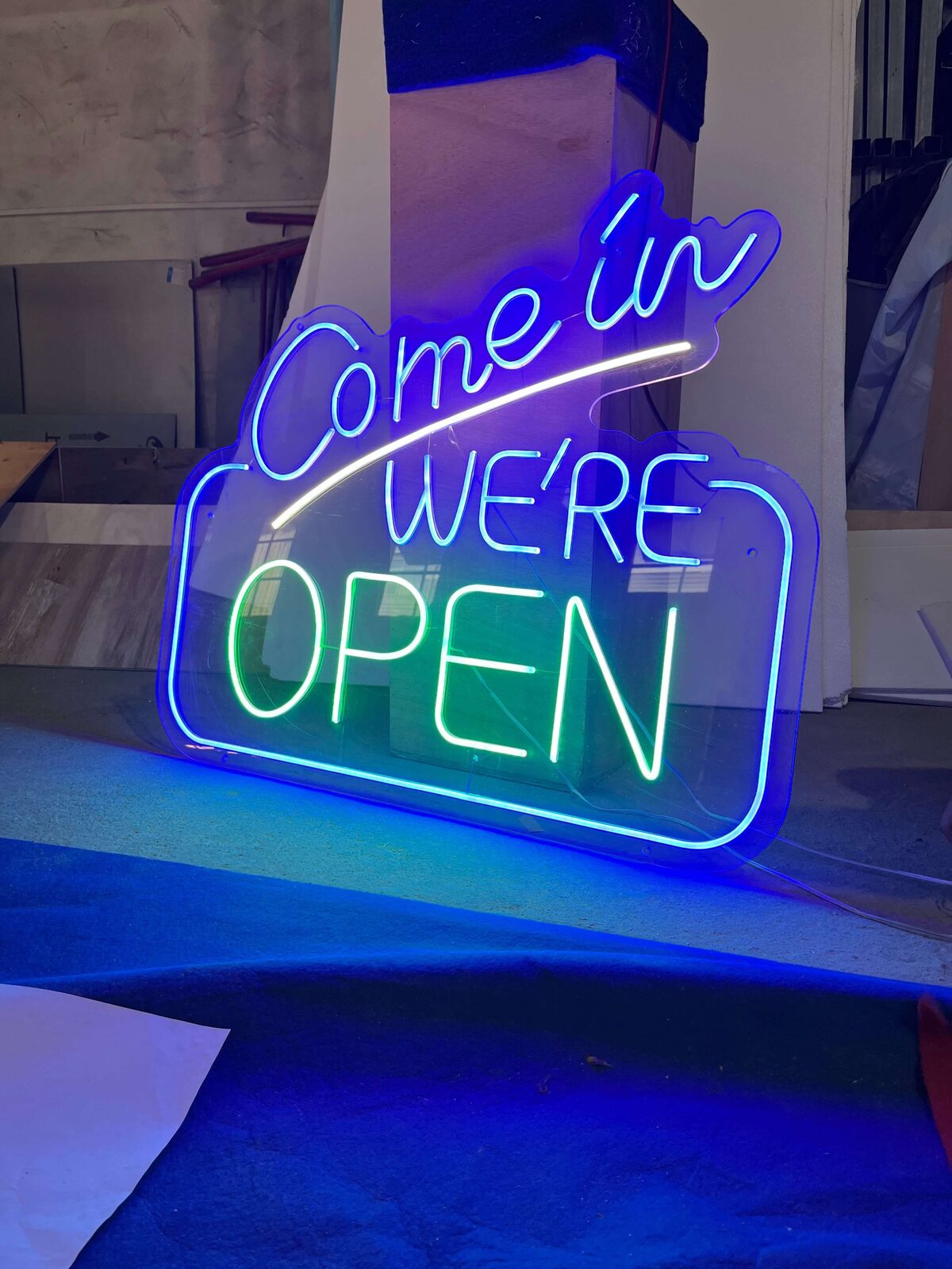 Illuminated dual color neon OPEN sign in quality control test