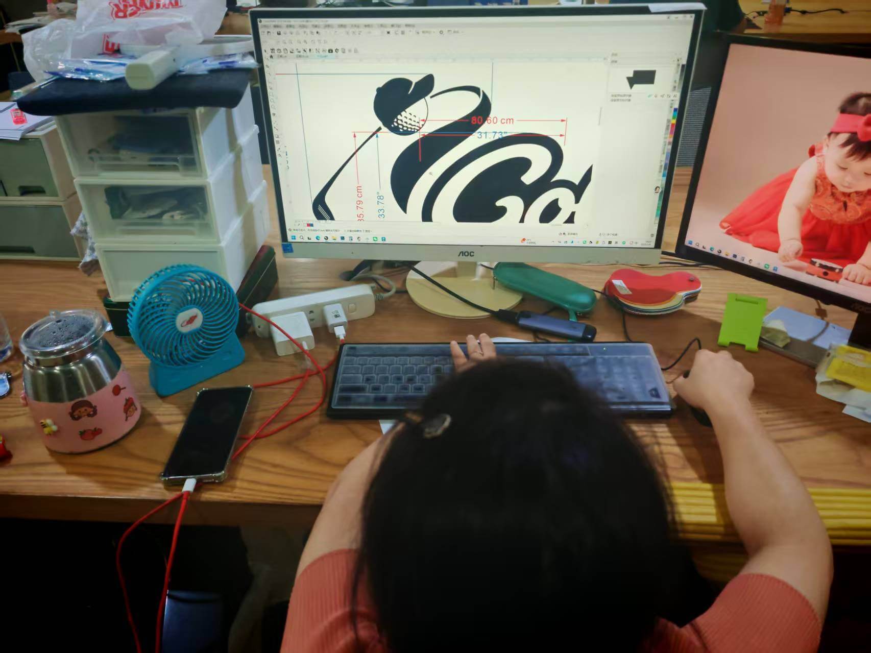 Pre-press technician calibrating vector pathing for golf ball dimple graphics