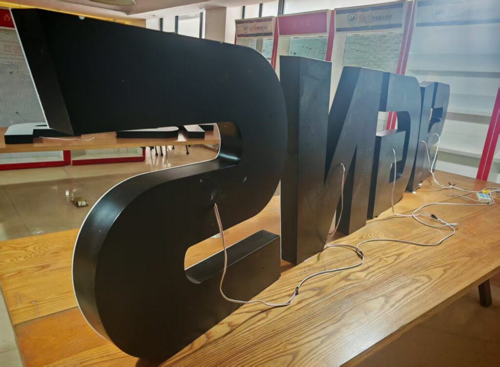 Black 3D acrylic letters on the bench