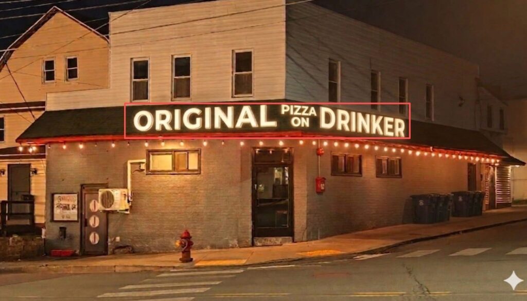 Illuminated bar storefront sign at night