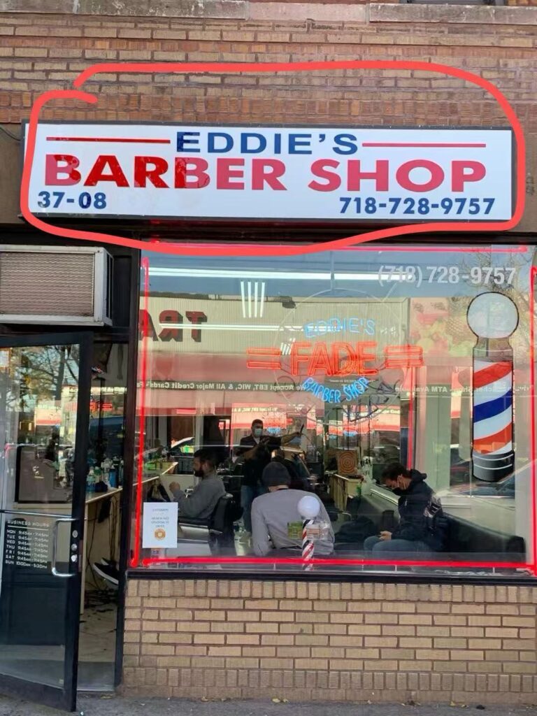 Eddies Barber Shop storefront light box sign
