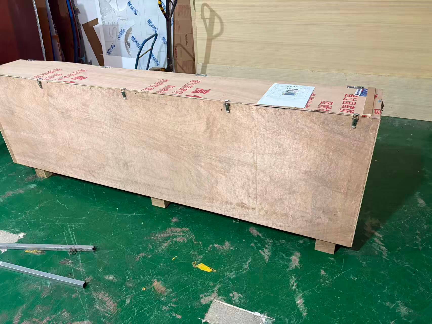 Reinforced export plywood crate prepared for ocean shipping at EndPoint Sign's Guangzhou packing bay